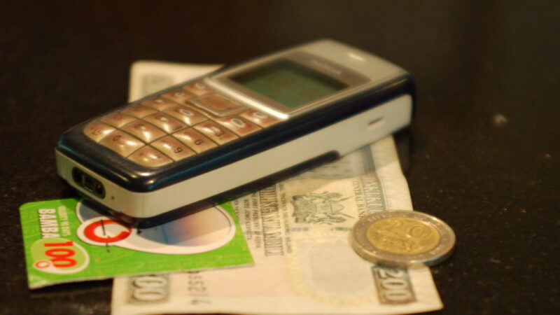 A person checking a mobile banking app on a smartphone