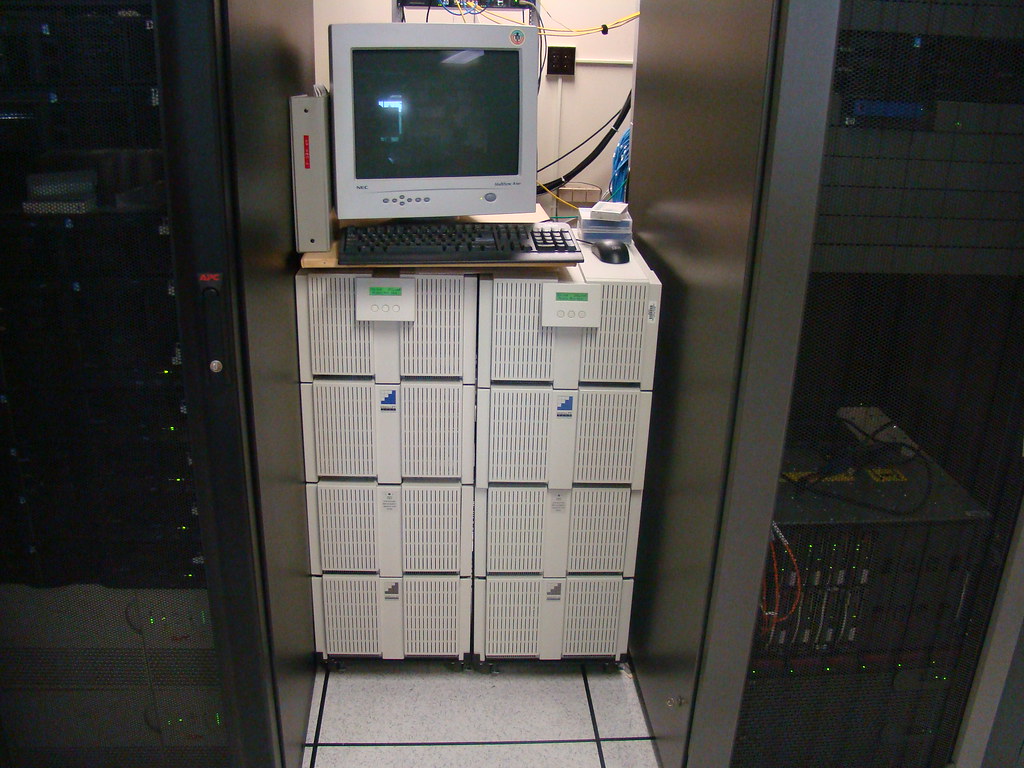 An uninterruptible power supply unit beside office equipment