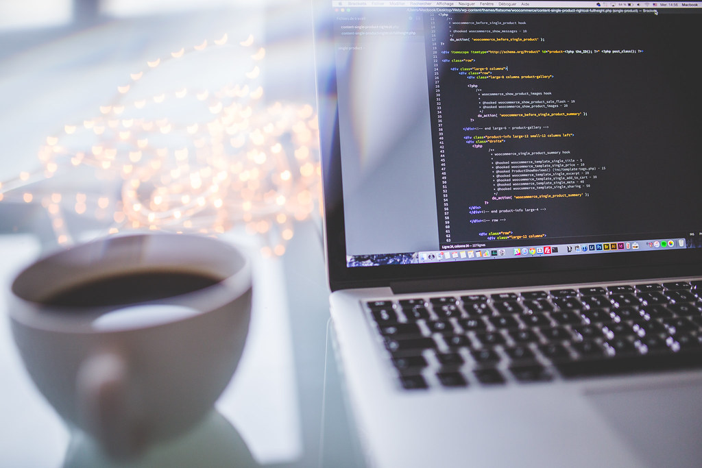 Developer working on code on a laptop